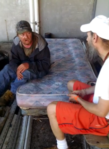 helping homeless man